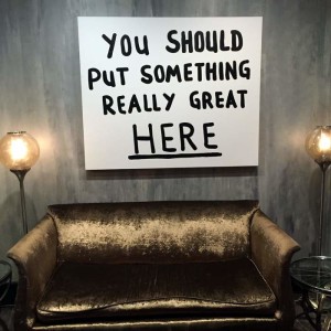 sofa and sign in Legacy Kitchen, Renaissance New Orleans Arts Hotel