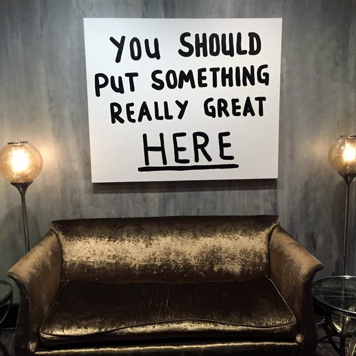 sofa and sign in Legacy Kitchen, Renaissance New Orleans Arts Hotel