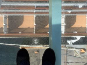peering through the glass-bottom stairway, ms Koningsdam, Holland America Line