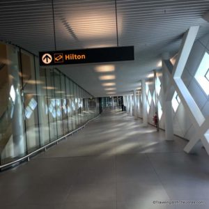 Hilton sign from Amsterdam Airport Schiphol directing travelers to Hilton Hotel