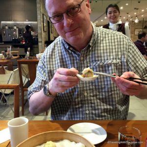 Mr. Jones devouring soup dumpling at Din Tai Fung in Taipei, Taiwan