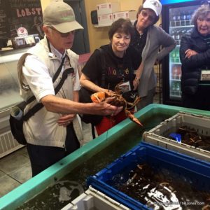 culinary tour guide explaining lobster, Charlottetown, Price Edward Island, Canada