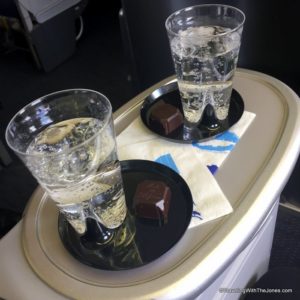 pre-flight beverage and chocolate, United Polaris Business Class