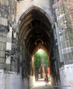 walking through the archway of 'The Dom' in Utrecht, The Netherlands