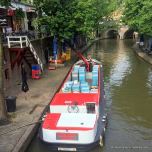 boat delivering supplies - Oudegracht (old canal) runs through the Utrecht, the Netherlands