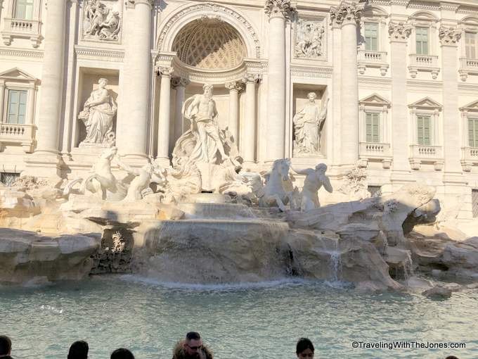tossing coins in Trevi Fountain, Rome